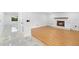 Bright living room features sleek wood floors and a cozy fireplace at 111 Main St, Windermere, FL 34786
