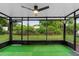 Screened in patio features a ceiling fan and artificial turf at 111 Main St, Windermere, FL 34786