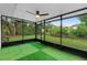 Screened in patio features a ceiling fan and a view of the backyard at 111 Main St, Windermere, FL 34786