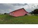 Expansive backyard ideal for recreation, featuring vibrant green grass and peaceful surroundings at 113 Kaigen Ct, Haines City, FL 33844