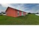 Spacious backyard showcasing lush green grass and ample room for outdoor activities and relaxation at 113 Kaigen Ct, Haines City, FL 33844