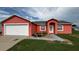 Charming single-Gathering home featuring a two-car garage and a well-maintained front yard landscape at 113 Kaigen Ct, Haines City, FL 33844