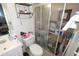 Compact bathroom equipped with a shower, toilet, and vanity, providing essential amenities at 11418 Ashboro Dr, Orlando, FL 32837
