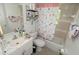 Well-lit bathroom featuring a shower, toilet, and vanity, designed for convenience at 11418 Ashboro Dr, Orlando, FL 32837