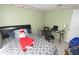 Cozy bedroom featuring a comfortable bed and functional workspace at 11418 Ashboro Dr, Orlando, FL 32837