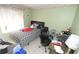 Bedroom with a bed, desk, and carpeted floor at 11418 Ashboro Dr, Orlando, FL 32837