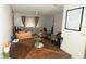 Open dining and living area, perfect for entertaining, featuring wood table and tile floors at 11418 Ashboro Dr, Orlando, FL 32837