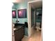 Stylish bathroom featuring updated fixtures, a modern vanity, and a shower with glass doors at 1292 Nadine Dr, Deltona, FL 32738