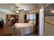 Bright bedroom featuring a ceiling fan, neutral walls, and built-in shelves providing storage at 1292 Nadine Dr, Deltona, FL 32738