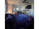 Bedroom featuring galaxy-themed bedding, complimented by sleek, modern furniture and ample storage at 1292 Nadine Dr, Deltona, FL 32738