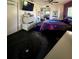 Bedroom featuring galaxy-themed bedding, complimented by sleek, modern furniture and ample storage at 1292 Nadine Dr, Deltona, FL 32738