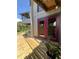 Inviting home exterior with red doors, a wooden ramp, and a charming 'HOME' sign at 1292 Nadine Dr, Deltona, FL 32738