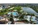 A high angle aerial view of the community's pool, lake, and recreational areas at 1544 Nassau Point Trl, Kissimmee, FL 34747