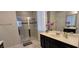 Modern bathroom featuring a glass-enclosed shower and double vanity with great counter space at 1544 Nassau Point Trl, Kissimmee, FL 34747