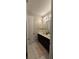 Bathroom with double vanity, tiled floor, and decorative wall accents at 1544 Nassau Point Trl, Kissimmee, FL 34747