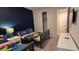 Blue-walled bedroom with carpet floors featuring two twin beds and a closet at 1544 Nassau Point Trl, Kissimmee, FL 34747
