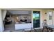 Indoor living space flows to an outdoor patio with a view of the lush backyard at 1544 Nassau Point Trl, Kissimmee, FL 34747