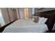 Comfortable main bedroom featuring a large bed, bathroom, and a neutral color scheme at 1544 Nassau Point Trl, Kissimmee, FL 34747
