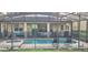 Screened-in pool and patio area with ample seating, outdoor furniture, and spa at 1544 Nassau Point Trl, Kissimmee, FL 34747