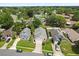 An aerial view showcases a neighborhood with manicured lawns, driveways, and mature trees at 189 Lakeside Cir, Sanford, FL 32773