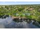 Enjoy the lakefront community's pool, tennis courts, and lush landscaping from this aerial view at 189 Lakeside Cir, Sanford, FL 32773