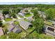 A residential area surrounded by lush greenery, streets, and beautiful homes from a bird's eye view at 189 Lakeside Cir, Sanford, FL 32773