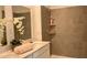 Well-appointed bathroom with a double sink vanity, tiled shower, and soothing color scheme for a relaxing experience at 2002 Punch Bowl Ave, Davenport, FL 33837