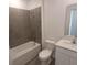 Modern bathroom with tiled shower, white fixtures, and sleek vanity at 2002 Punch Bowl Ave, Davenport, FL 33837