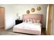 Stylish bedroom featuring a plush bed, elegant decor, and a tranquil ambiance for restful nights at 2002 Punch Bowl Ave, Davenport, FL 33837