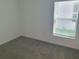 Bright bedroom with a large window offers lots of natural light and soft carpet at 2002 Punch Bowl Ave, Davenport, FL 33837