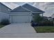 Charming single-Gathering home with a two-car garage and well-maintained landscaping at 2002 Punch Bowl Ave, Davenport, FL 33837