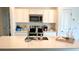 Modern kitchen boasts stainless steel appliances, white cabinets, and a spacious countertop for meal preparation at 2002 Punch Bowl Ave, Davenport, FL 33837