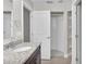Bathroom featuring a walk-in shower, granite vanity, and ample storage space for a luxurious and organized experience at 2044 Hillview Cir, Deltona, FL 32738