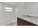Bathroom showcasing a tub with shower, granite vanity, and modern fixtures for a clean and comfortable space at 2044 Hillview Cir, Deltona, FL 32738