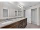 Bathroom featuring double vanity, granite countertops, and modern fixtures, blending elegance and functionality at 2044 Hillview Cir, Deltona, FL 32738