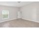 Bedroom with a large window and light tile floors at 2044 Hillview Cir, Deltona, FL 32738