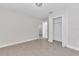 Neutral walls and tile floors compliment this light and bright bedroom at 2044 Hillview Cir, Deltona, FL 32738