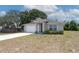 Charming single-story home features a well-maintained lawn and a welcoming front entrance with modern architectural details at 2044 Hillview Cir, Deltona, FL 32738