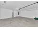 Spacious garage with concrete floor, water heater, and ample storage, ready for vehicles and hobbies at 2044 Hillview Cir, Deltona, FL 32738