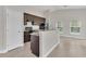 Bright kitchen boasts granite countertops and modern appliances, creating an inviting and efficient cooking environment at 2044 Hillview Cir, Deltona, FL 32738