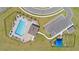 Aerial view showcasing community pool, parking, and playground for residents' enjoyment at 2227 Chris Dr, Winter Haven, FL 33884