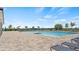 Community swimming pool with lounge chairs and a large deck, perfect for relaxation and recreation at 2227 Chris Dr, Winter Haven, FL 33884