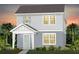 Charming two-story home with a welcoming front porch and lush landscaping at 2237 Southbury Dr, Kissimmee, FL 34744