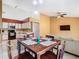Open dining area blends seamlessly with the kitchen and living room, perfect for Gathering meals at 2314 Cormorant St, Kissimmee, FL 34743
