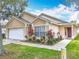 Beautiful single-story home with a well-maintained lawn, walkway, and inviting front entrance at 2314 Cormorant St, Kissimmee, FL 34743