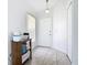 Bright foyer with tile flooring, a closet, and a front door, creating a welcoming entrance at 2314 Cormorant St, Kissimmee, FL 34743