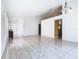 Open-concept living room boasts tile flooring, neutral paint, and stylish lighting fixtures at 2314 Cormorant St, Kissimmee, FL 34743