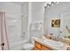 Bathroom with shower and tub featuring a clean and functional layout at 2343 Caravelle Cir, Kissimmee, FL 34746