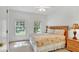 Comfortable bedroom with sunlit windows offering natural light and serene views at 2343 Caravelle Cir, Kissimmee, FL 34746