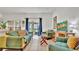 Bright living room with tile floors, sliding glass doors, and comfortable seating at 2343 Caravelle Cir, Kissimmee, FL 34746